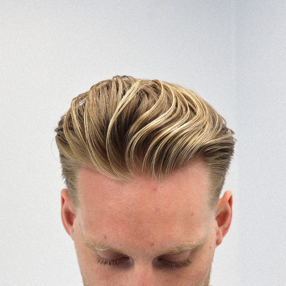 Man looking down with loose throwback hair