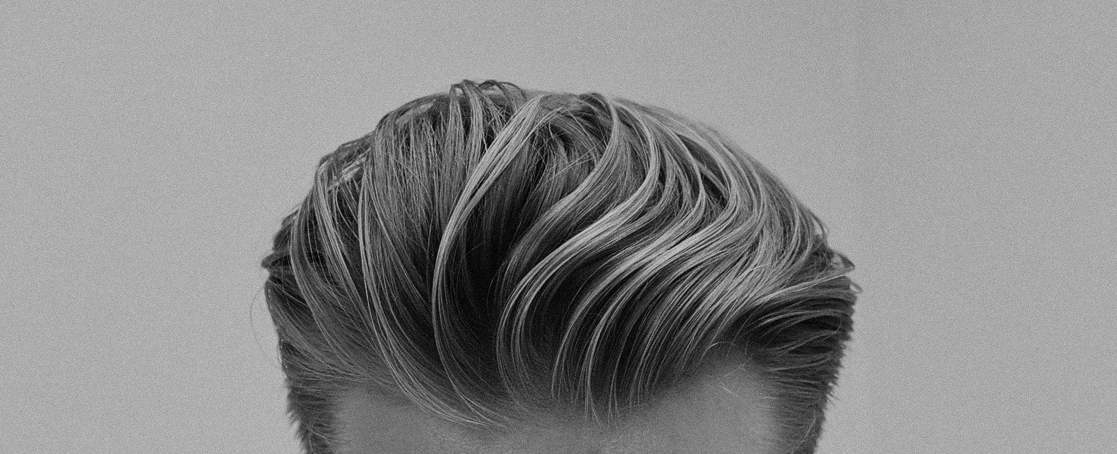 Man looking down with loose throwback hair